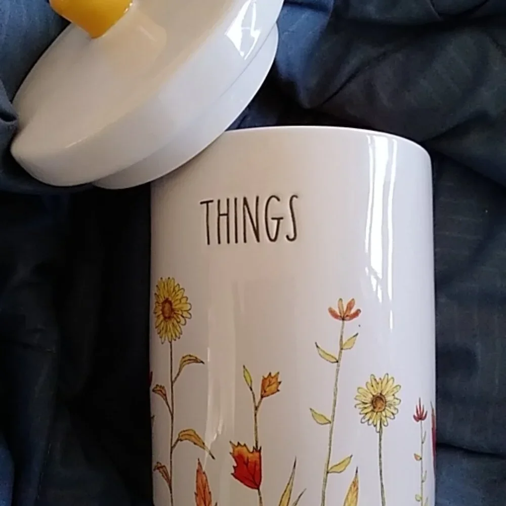 Bathroom Organizer: Cotton Ball Holder by Rae Dunn with orange interior